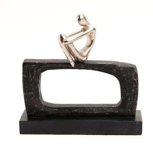 Figurine argentée assise