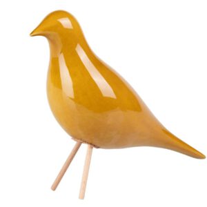 Oiseau jaune sur pied